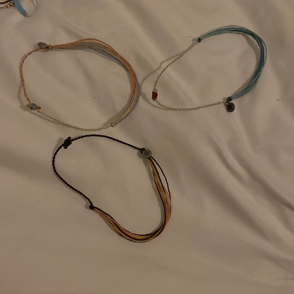 3 multicolored puravida bracelets